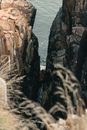 A Narrow River Between Rocky Cliff into the Sea