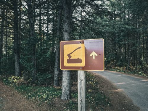 Free A road sign in a forest indicating a trail in a Canadian national park. Stock Photo