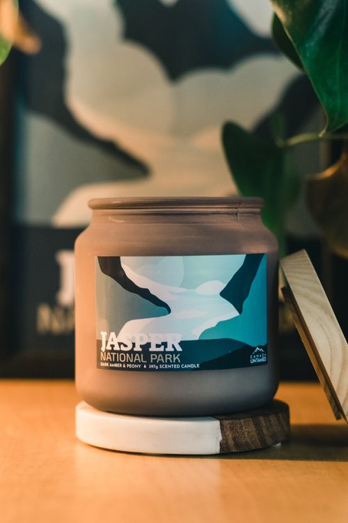 Free Close-up of a Jasper National Park scented candle in a cozy setting indoors. Stock Photo