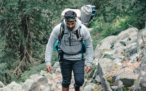 Man Hiking up Rocky Trail