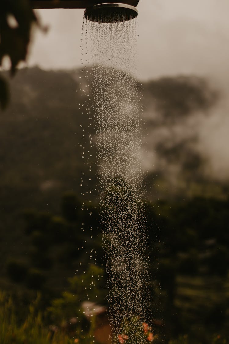 A Water Pouring From An Outdoor Shower