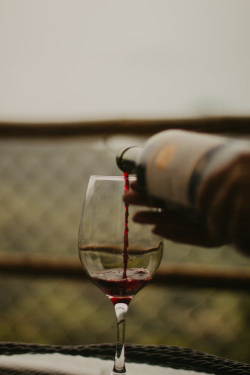 Free A Clear Glass of Red Wine Stock Photo