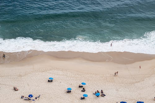 People on Sand Beach at Ocean