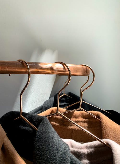 Close-Up Photograph of Hangers with Clothes