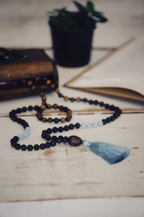 Wooden Prayer Beads on White Table