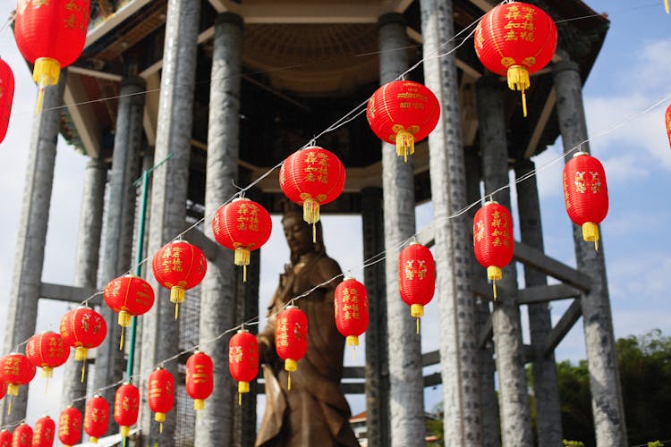 Red And Yellow Chinese Lanterns Hanging On Wires