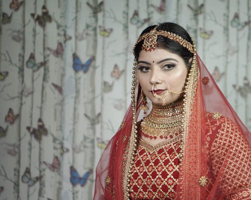 Free Photo of a Woman Wearing Red and Gold Traditional Clothes Stock Photo