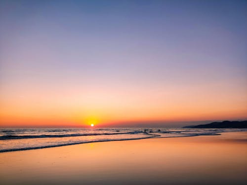 Photograph of a Beach During Sunset