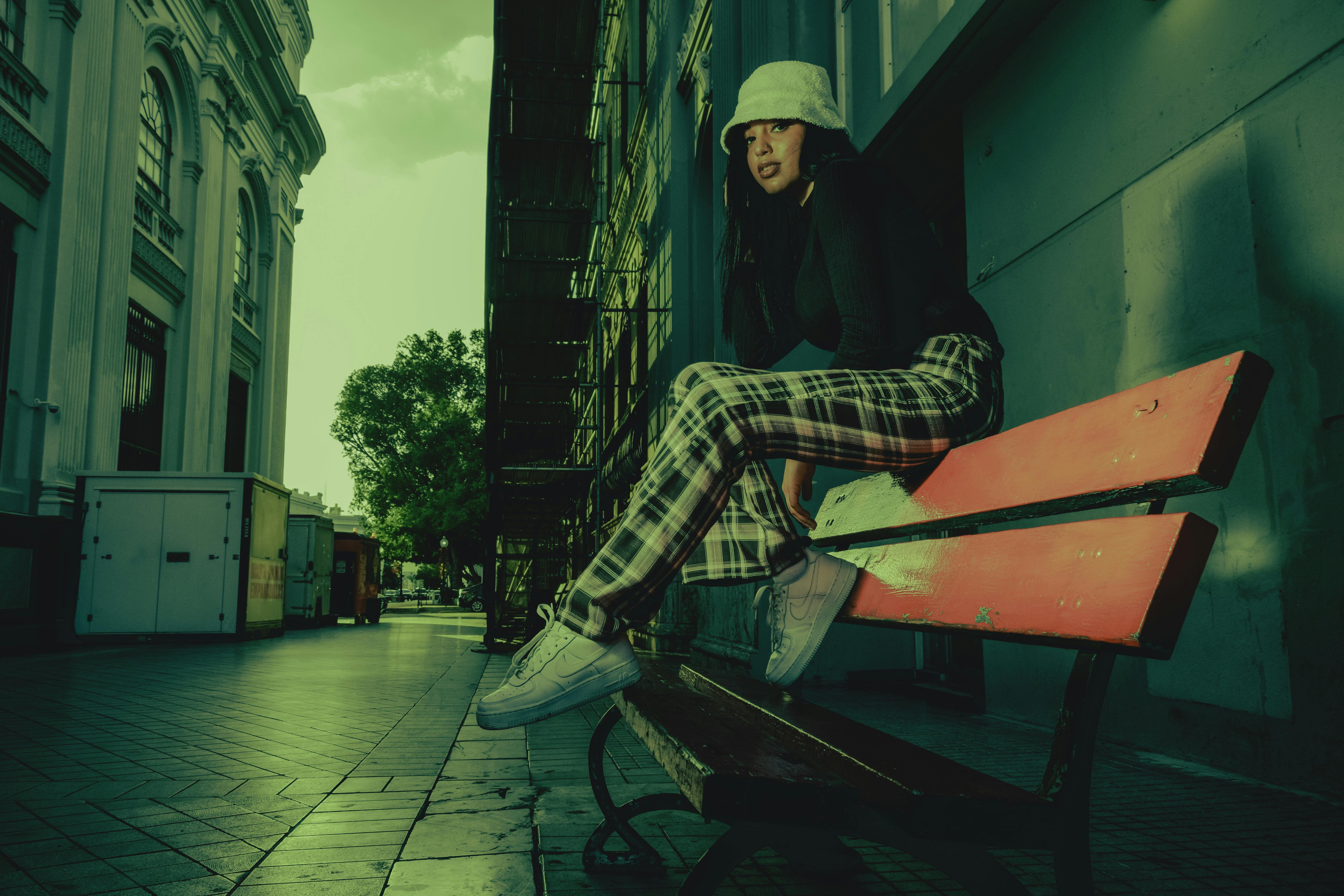 Stylish woman sitting on a bench