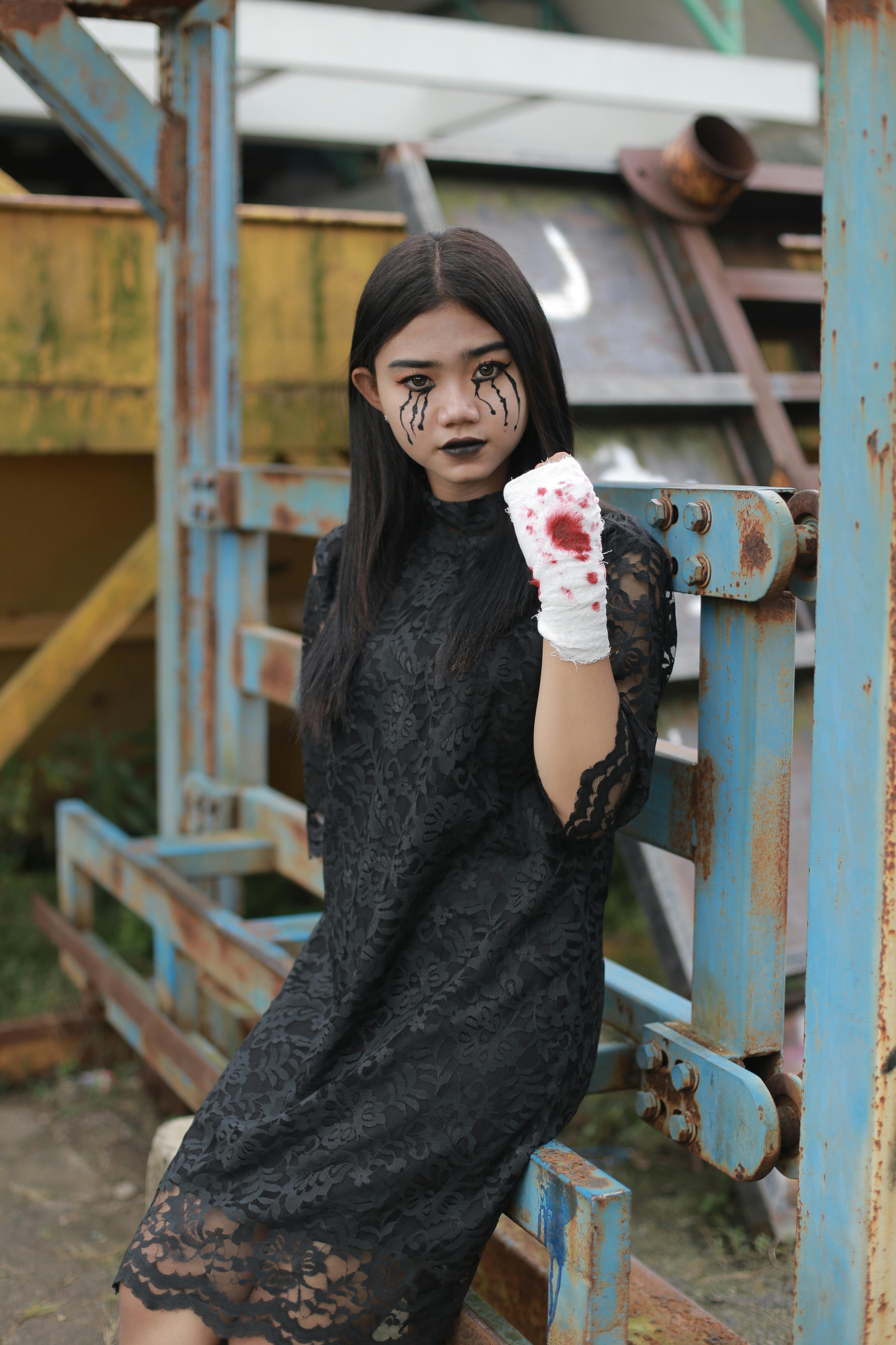 Girl in Black Lace Dress and Halloween Makeup Sitting on a Rusted  Construction  Free Stock Photo