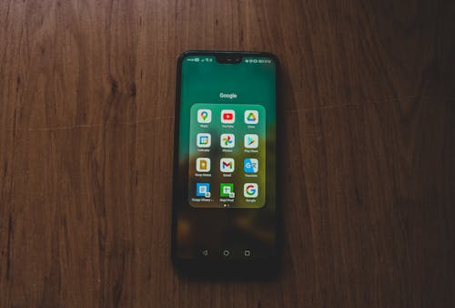 Free A Smartphone on a Wooden Surface Stock Photo