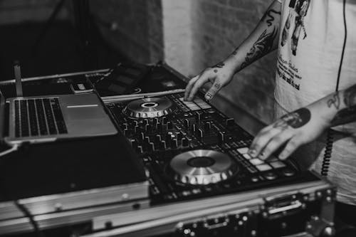 Free Person Playing Dj Mixer in Grayscale Photography Stock Photo