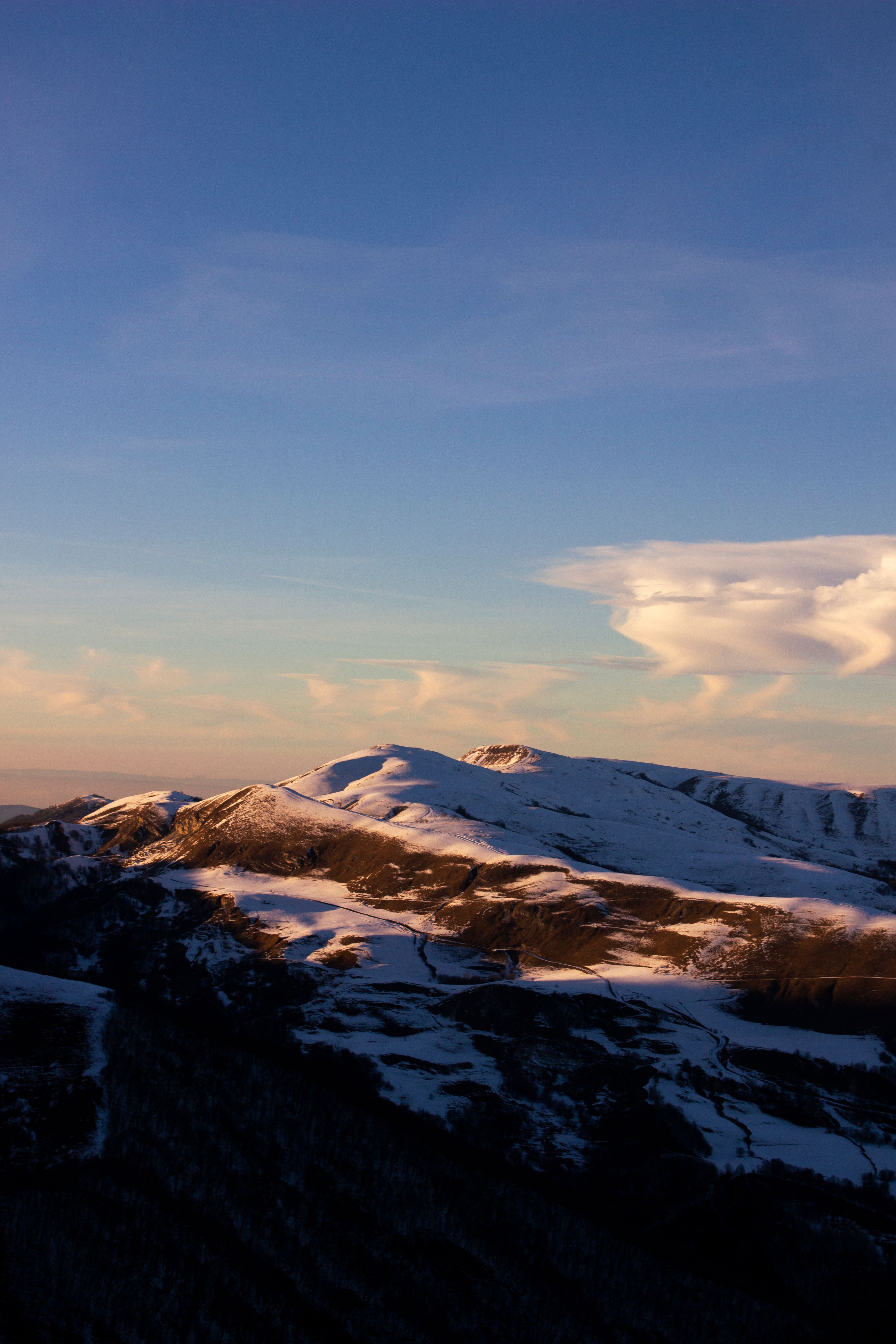 Snow Covered Mountains Under Blue Sky · Free Stock Photo