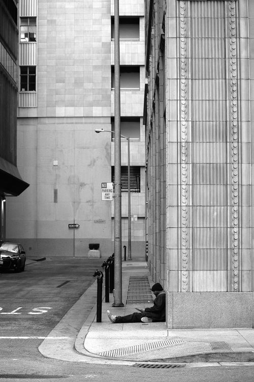 Free Minimalist urban alley with architecture in San Francisco, featuring a solitary figure. Stock Photo