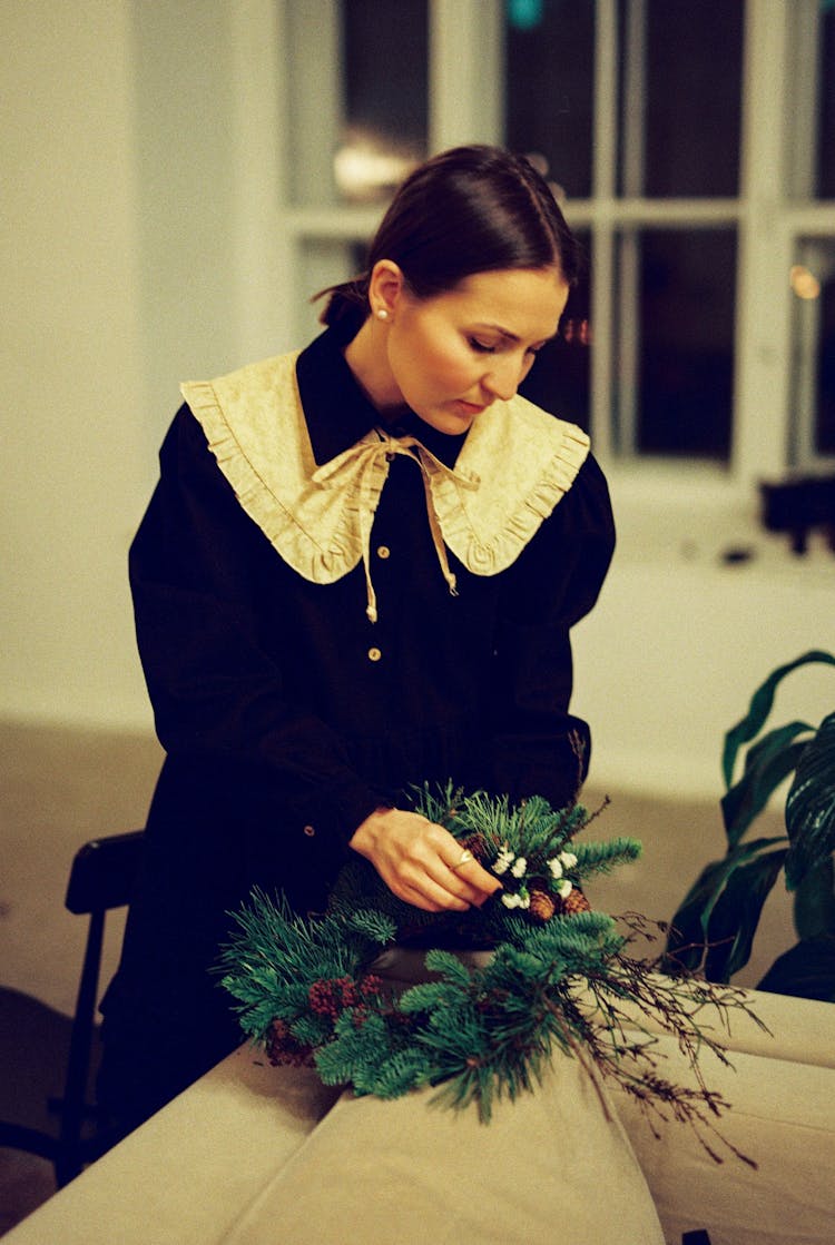 Woman Working On Christmas Wreath