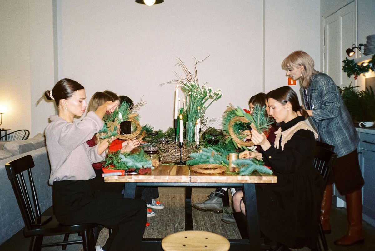Group of women doing crafts together at a home workshop