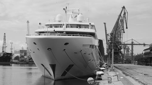 Grayscale Photo of a Ship on Dock