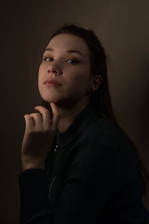 Woman in Black Long Sleeves Posing 