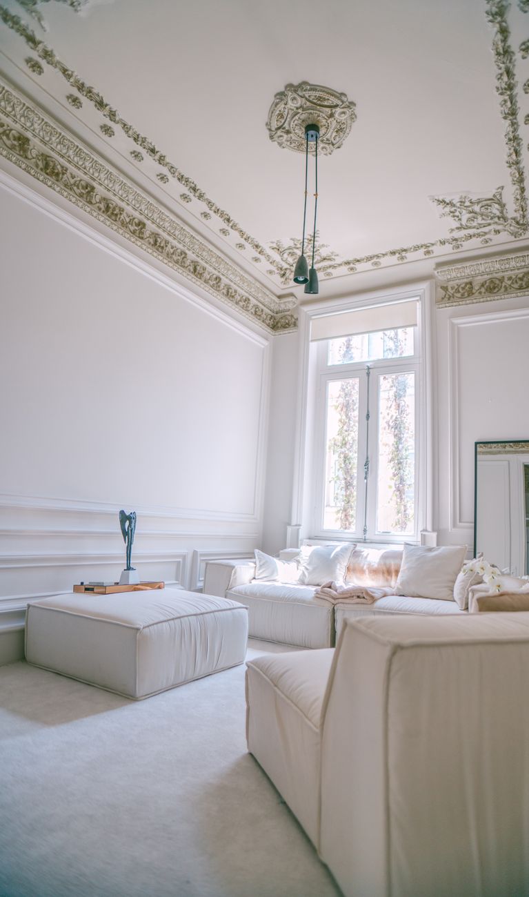 Luxurious Ottoman style living room in Istanbul with ornate ceiling and modern decor.