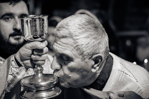 Man Kissing Chalice