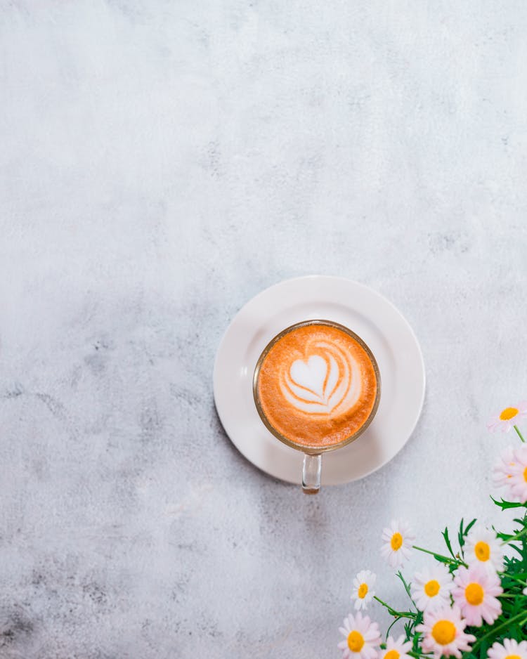 Cup Of Coffee With Heart Drawn In Milk On Top