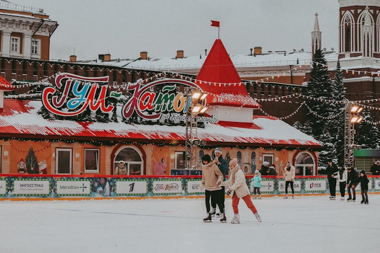 People Skating On A Rink During Winter