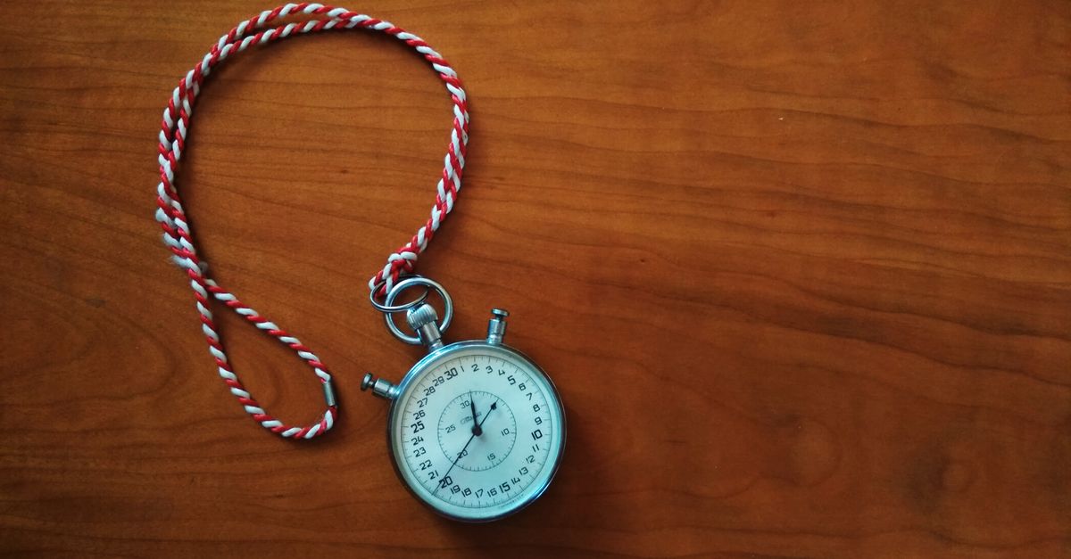 A stopwatch on a surface representing ongoing SEO competitor monitoring and time-based tracking