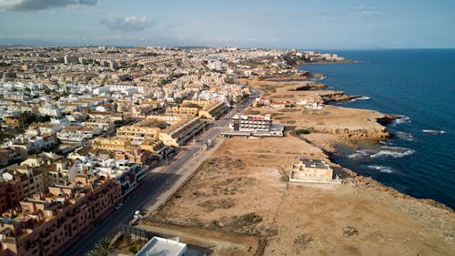 Aerial View of City Buildings Near Body of Water