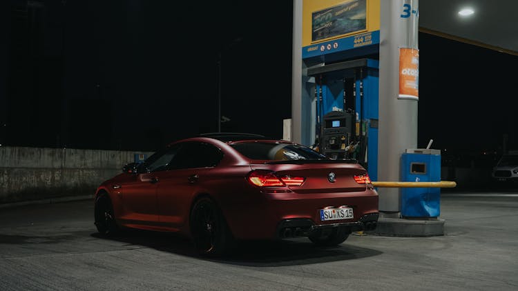 A Sports Car At A Gas Station