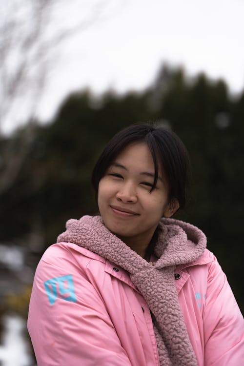 Woman in Pink Jacket Smiling