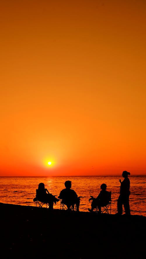 Silhouette of People at the Beach