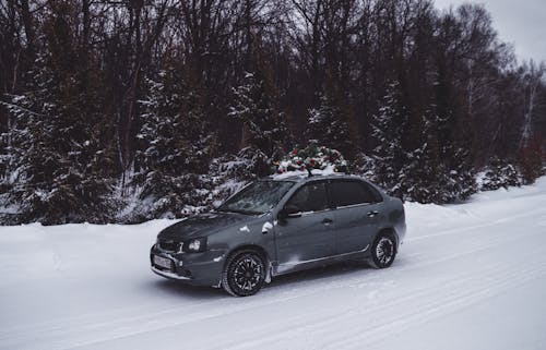 Black Car on Snow Covered Ground