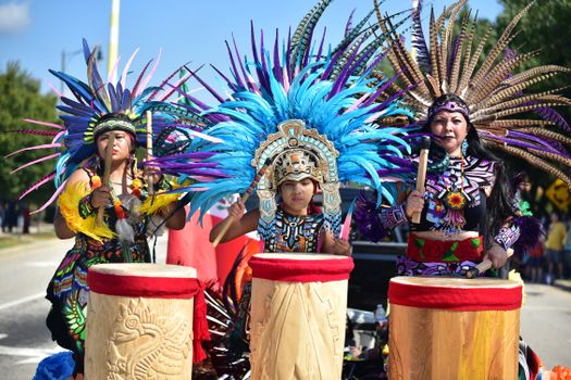People Wearing Gold and Red Traditional Dress