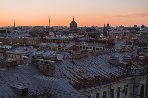 Free A stunning sunset over the historic rooftops of St. Petersburg, Russia. Stock Photo