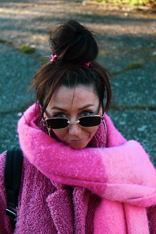 Woman in Pink Fur Jacket Wearing Sunglasses