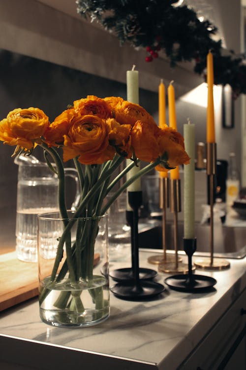 Orange Flowers in Clear Glass Vase