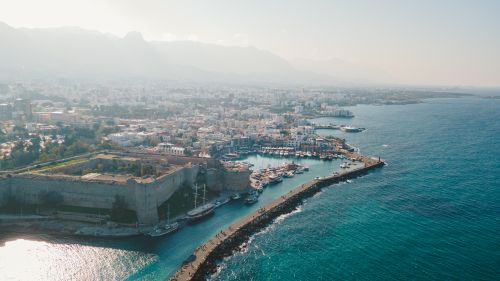 Free A breathtaking aerial view of Kyrenia Castle and the bustling harbor in Cyprus. Stock Photo