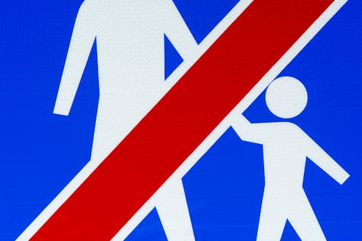 Close-up of a pedestrian prohibition sign with graphic elements on a blue background.