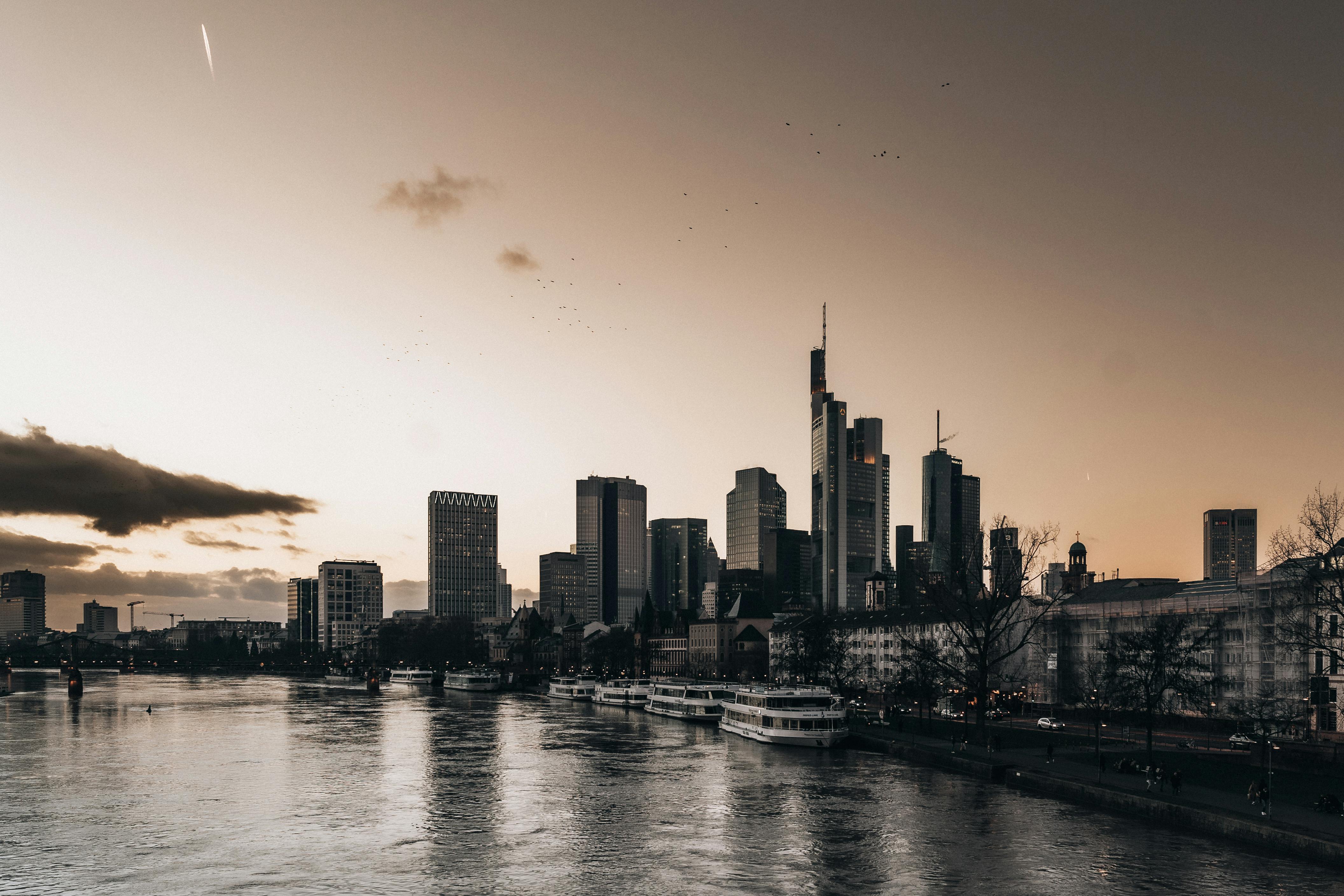 European Central Bank tower and Frankfurt skyline at dusk.