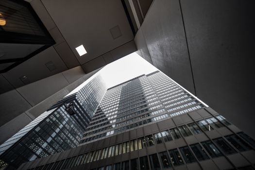 A striking view of skyscrapers from below, highlighting urban architecture and design.