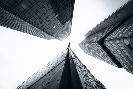 Low angle view of skyscrapers emphasizing architecture against the sky.