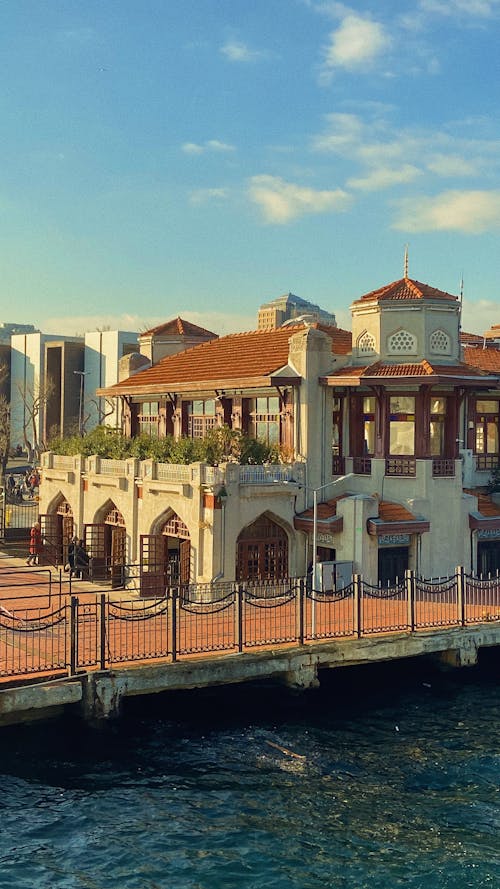 Brown and White Concrete Building near the River