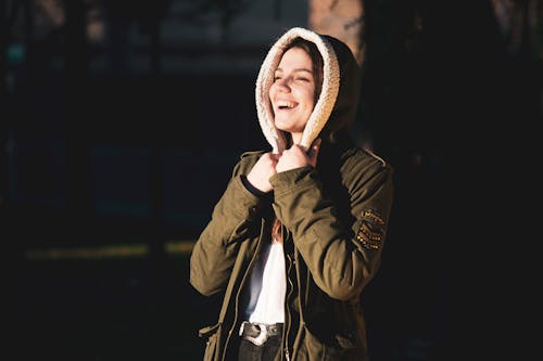 Free Woman in Green Hoodie Jacket Smiling Stock Photo