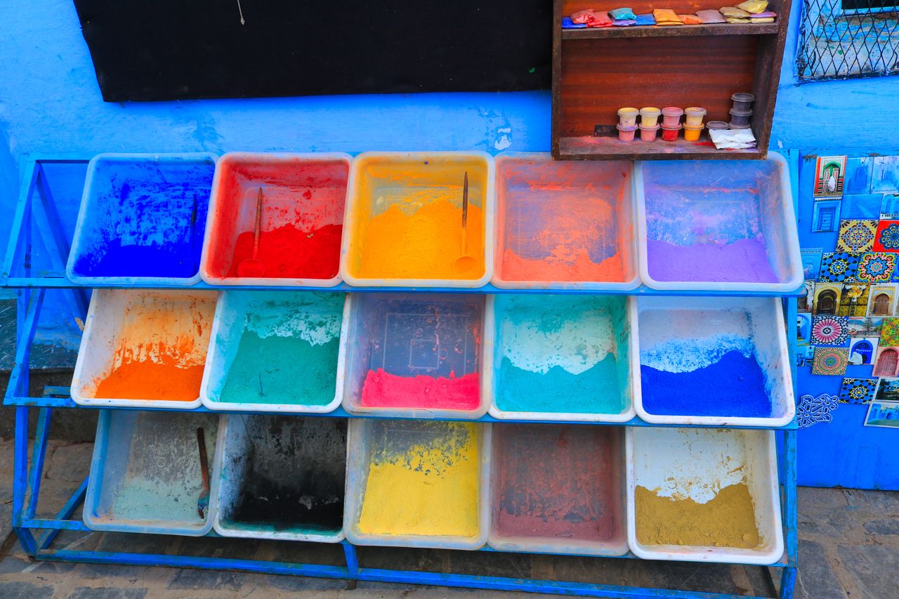 array of colorful powdered pigments in plastic trays perfect for art p