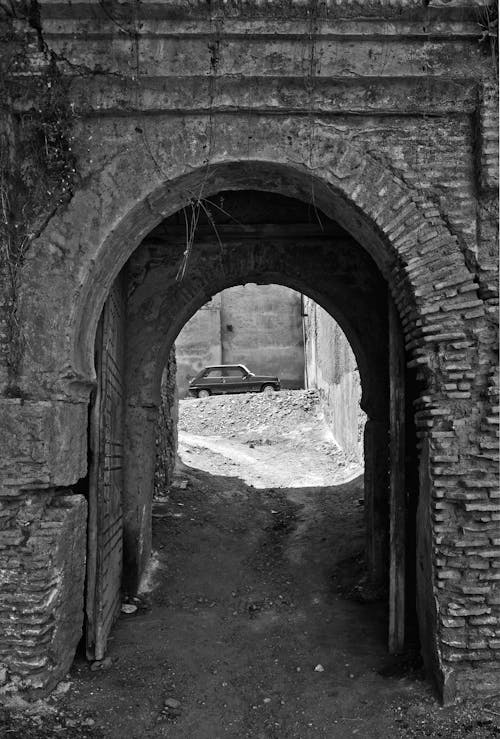 Grayscale Photo of Archway