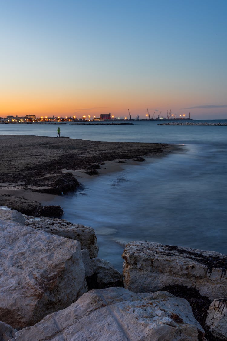 Sea Beach With Rocks On Sunset