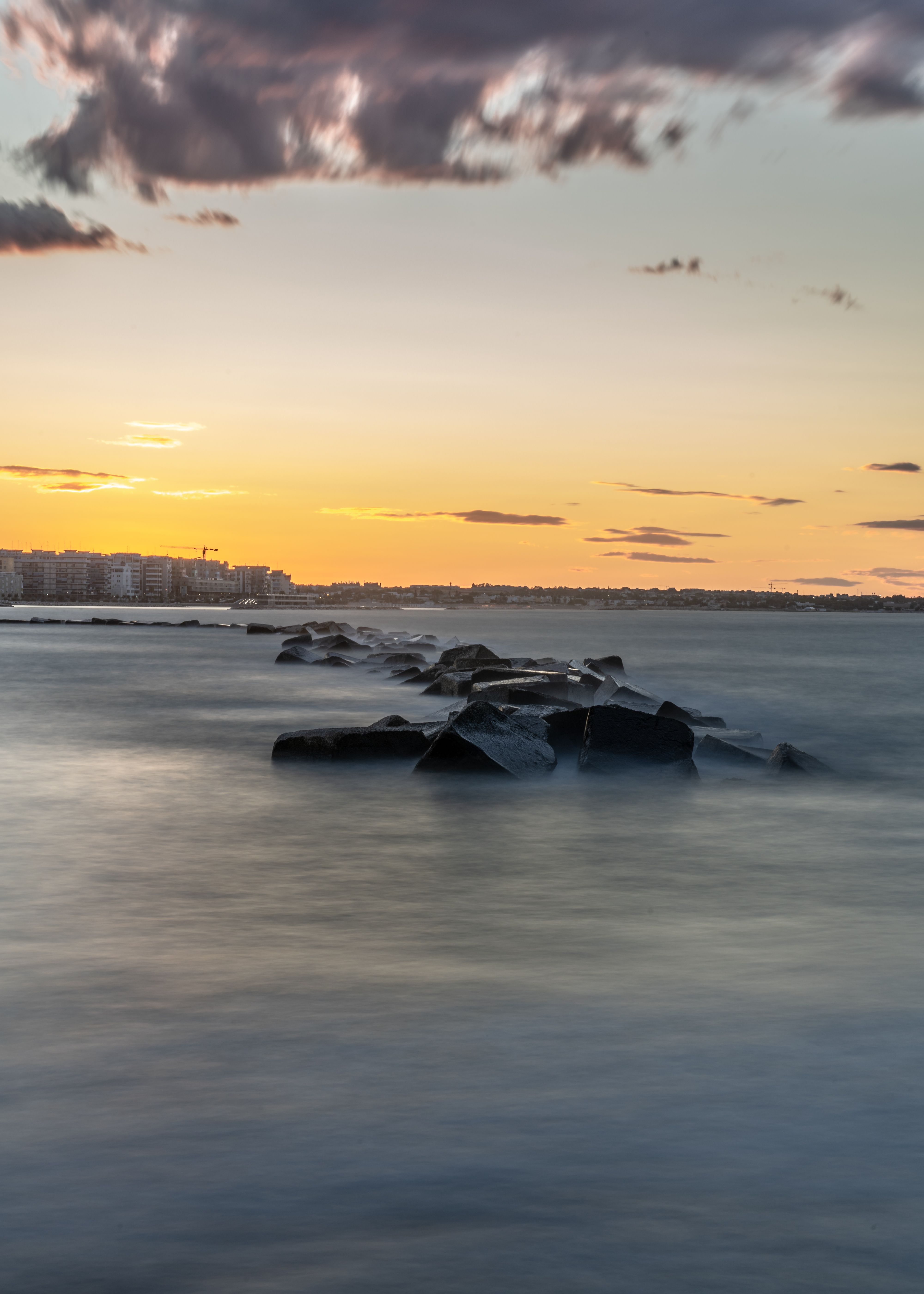 Big Rocks on Body of Water During Golden Hour · Free Stock Photo
