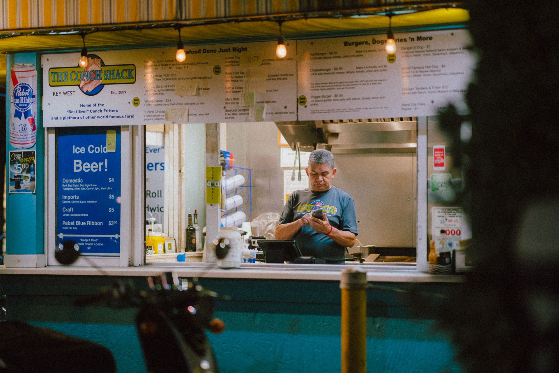 Man Using Phone Inside a Store