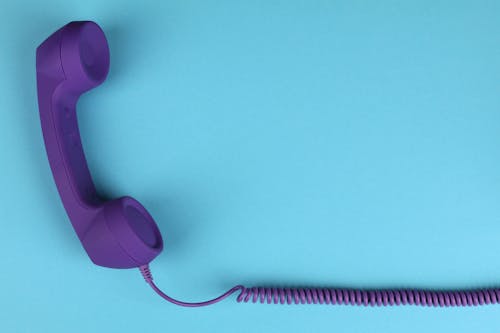 Purple Telephone on Blue Background