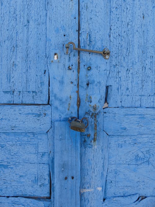 Free Blue Wooden Door With Padlock Stock Photo